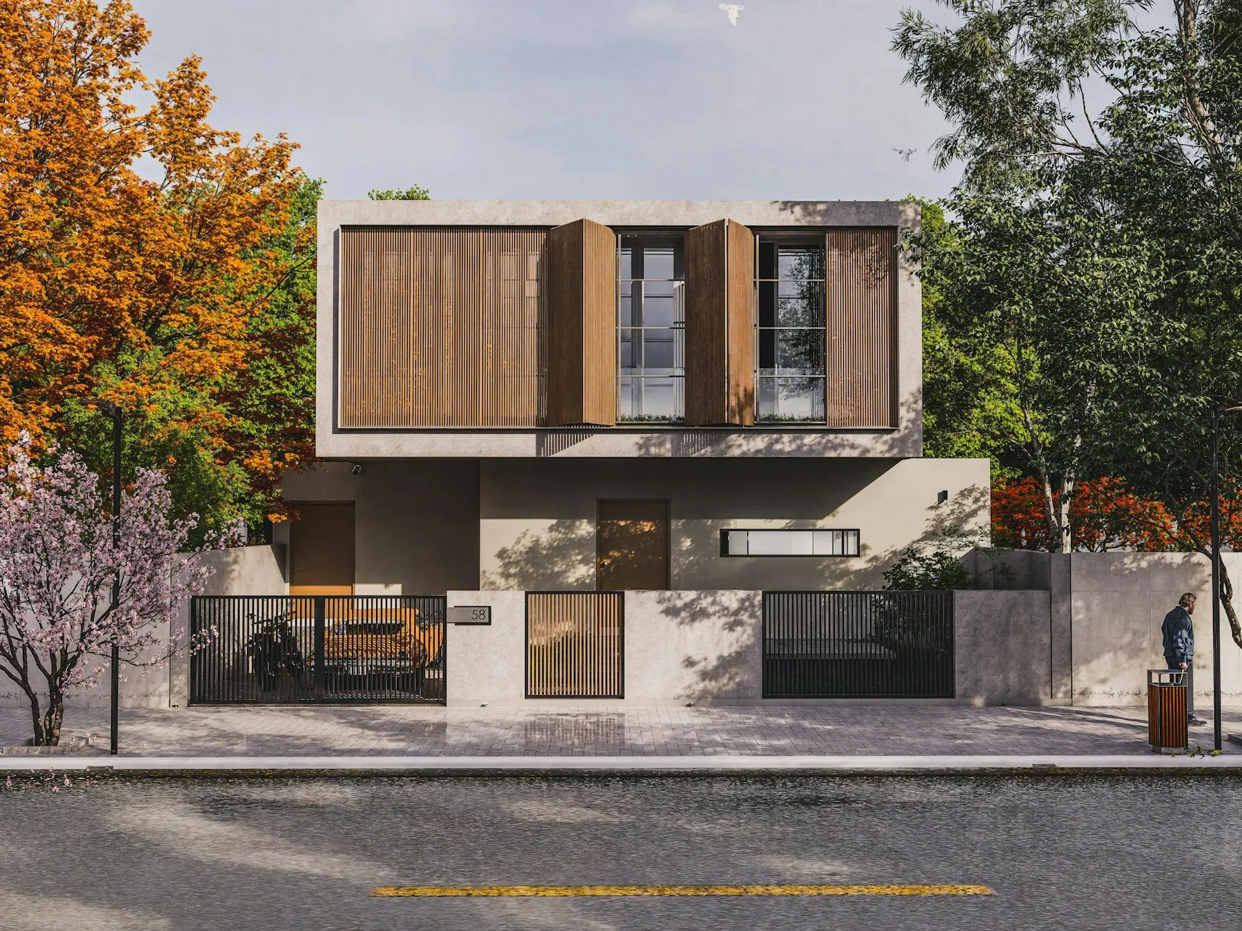 A concrete and timber house among autumn trees on a residential street